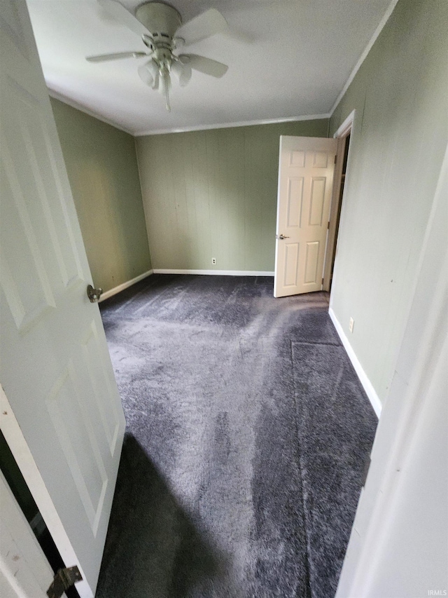 206 S Van Buren St, Monroe, IN 46772 - unfurnished room featuring dark colored carpet, baseboards, ceiling fan, and crown molding