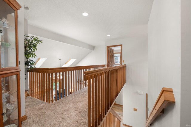 6615 Cherry Hill Pkwy, Fort Wayne, IN 46835 - corridor with carpet flooring, recessed lighting, a skylight, and lofted ceiling