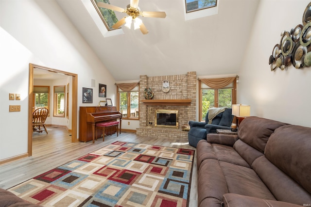 6615 Cherry Hill Pkwy, Fort Wayne, IN 46835 - living area featuring high vaulted ceiling, a skylight, healthy amount of natural light, ceiling fan, and light wood finished floors