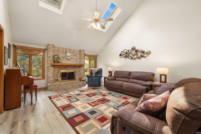 6615 Cherry Hill Pkwy, Fort Wayne, IN 46835 - living area with a skylight, high vaulted ceiling, light wood finished floors, a ceiling fan, and a fireplace