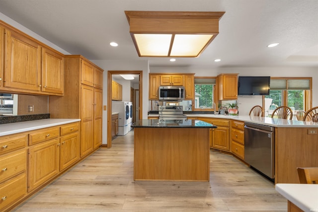 6615 Cherry Hill Pkwy, Fort Wayne, IN 46835 - kitchen featuring appliances with stainless steel finishes, healthy amount of natural light, a peninsula, light wood-style floors, and recessed lighting