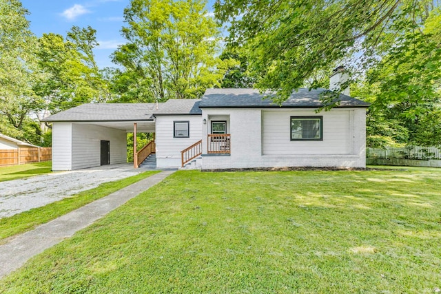 340 W Turner St, Bloomfield, IN 47424 - view of front of property with driveway, an attached carport, a chimney, and a shingled roof
