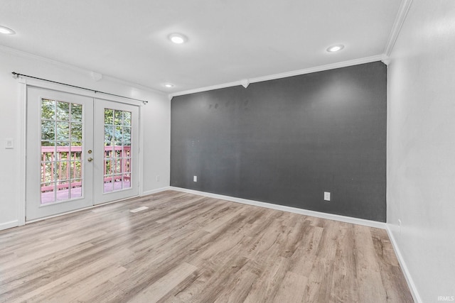 340 W Turner St, Bloomfield, IN 47424 - empty room featuring crown molding, french doors, wood finished floors, baseboards, and recessed lighting