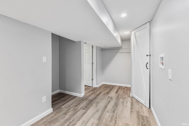 340 W Turner St, Bloomfield, IN 47424 - finished below grade area with baseboards, light wood-style floors, and recessed lighting