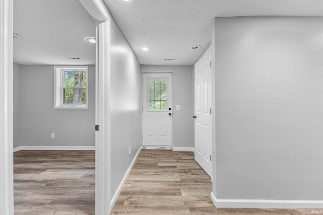 340 W Turner St, Bloomfield, IN 47424 - entryway featuring plenty of natural light, a textured ceiling, wood finished floors, baseboards, and recessed lighting
