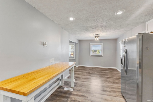 340 W Turner St, Bloomfield, IN 47424 - dining room featuring dark wood-type flooring, baseboards, a textured ceiling, and recessed lighting