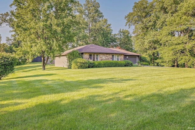 532 Bex Addition Dr, Bedford, IN 47421 - view of green lawn featuring an attached garage