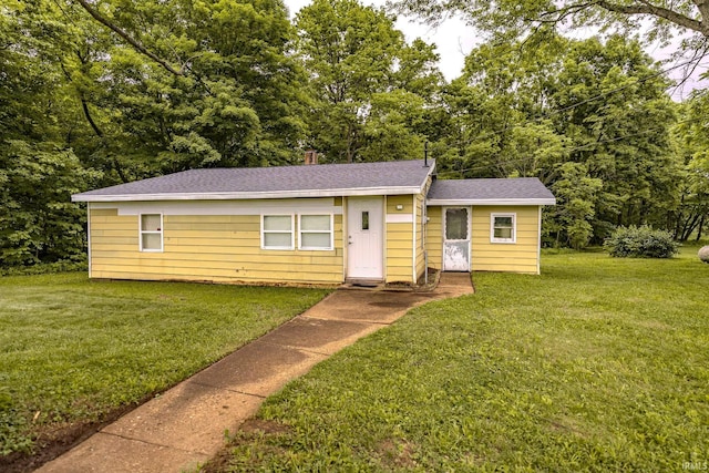 7921 S 700 W Rd, Williamsport, IN 47993 - bungalow-style home with a front lawn and roof with shingles