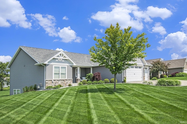 57373 Emerald Chase Ln, Goshen, IN 46528 - view of front of home with a garage, a front yard, stone siding, and roof with shingles