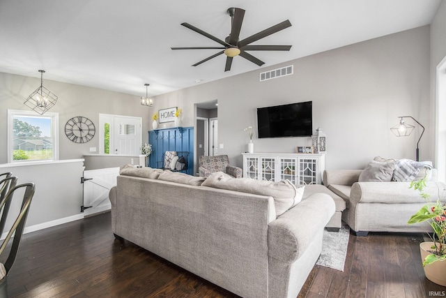 57373 Emerald Chase Ln, Goshen, IN 46528 - living room with a ceiling fan, dark wood finished floors, a chandelier, and baseboards