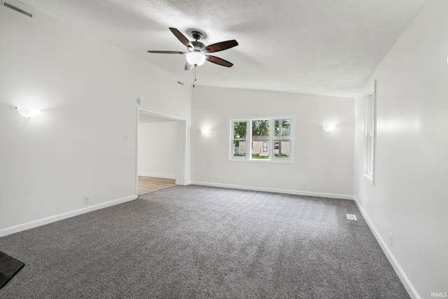 503 Graceland Ave, Claypool, IN 46510 - carpeted spare room with vaulted ceiling, ceiling fan, a textured ceiling, and baseboards