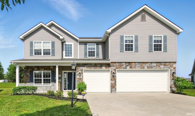 13395 Synch Ct, Fort Wayne, IN 46814 - view of front of home with a garage, covered porch, driveway, and stone siding
