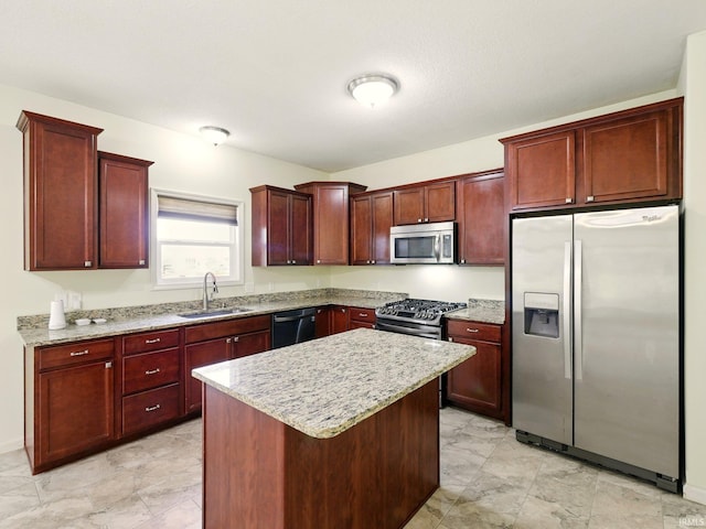 13395 Synch Ct, Fort Wayne, IN 46814 - kitchen with appliances with stainless steel finishes, a sink, reddish brown cabinets, and a kitchen island