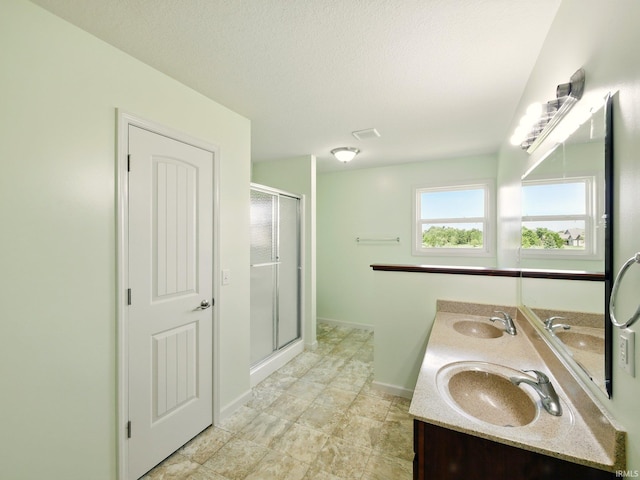 13395 Synch Ct, Fort Wayne, IN 46814 - full bathroom featuring double vanity, a shower stall, and baseboards