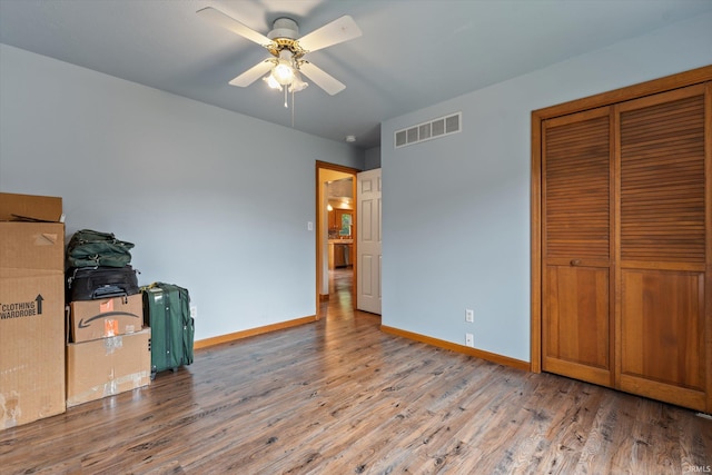 25651 Cypress Ct, Elkhart, IN 46517 - unfurnished bedroom featuring wood finished floors, baseboards, and a closet