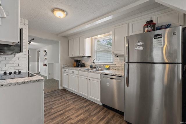 2527 Woodmont Dr, South Bend, IN 46614 - kitchen with stainless steel appliances, a sink, a textured ceiling, white cabinets, and dark wood-type flooring