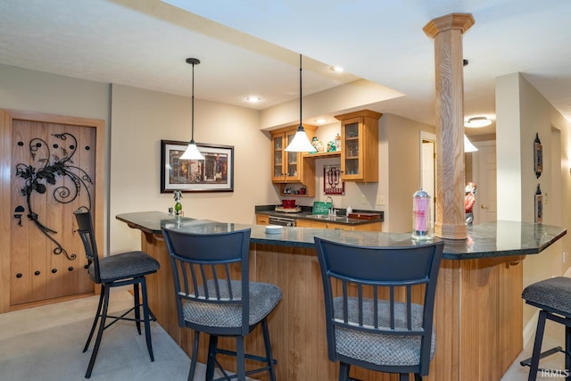 5920 E Lampkins Ridge Rd, Bloomington, IN 47401 - indoor wet bar featuring ornate columns, decorative light fixtures, light colored carpet, and recessed lighting