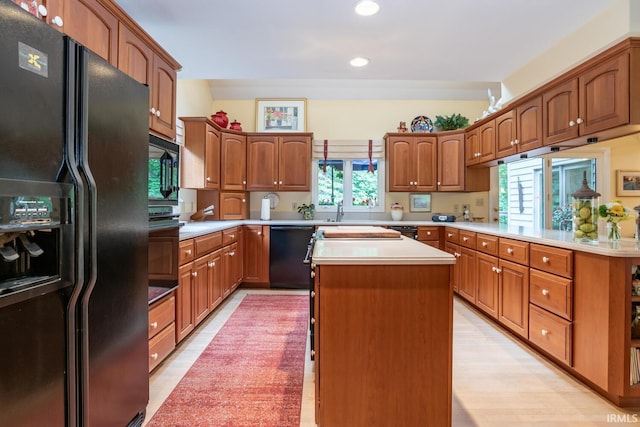 5920 E Lampkins Ridge Rd, Bloomington, IN 47401 - kitchen featuring black appliances, healthy amount of natural light, recessed lighting, a kitchen island, and light countertops