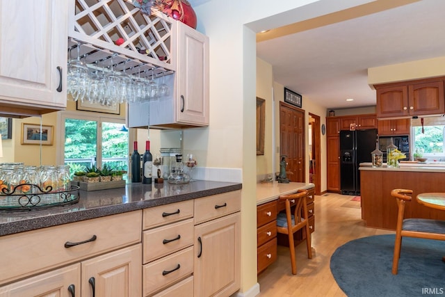 5920 E Lampkins Ridge Rd, Bloomington, IN 47401 - kitchen with black appliances, light wood-type flooring, and recessed lighting