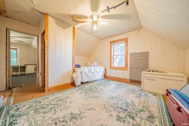 5528 N 250 W Unit 27, Lafontaine, IN 46940 - bedroom with lofted ceiling, a ceiling fan, and wood walls