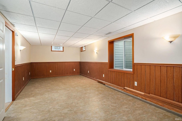 1826 E Donald St, South Bend, IN 46613 - basement featuring a wainscoted wall, tile patterned floors, a drop ceiling, and wood walls