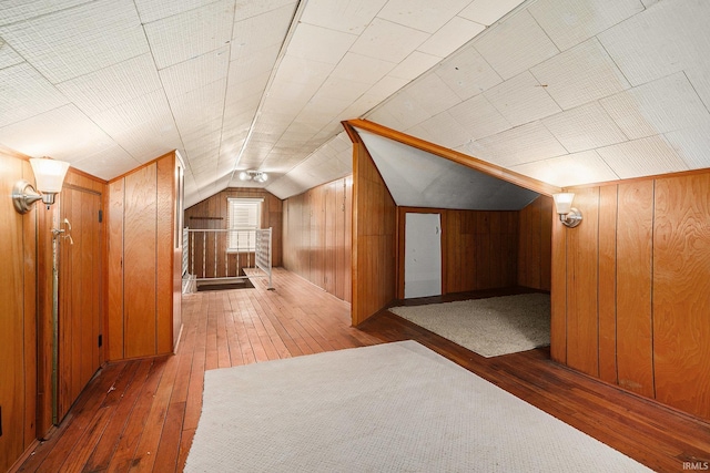 1826 E Donald St, South Bend, IN 46613 - additional living space with hardwood / wood-style flooring, wood walls, and lofted ceiling