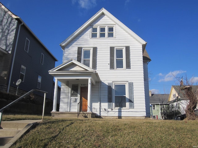508 W 2nd St, Marion, IN 46952 - view of front of property with covered porch, a front yard, and cooling unit
