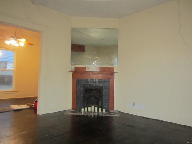 508 W 2nd St, Marion, IN 46952 - unfurnished living room with wood finished floors, a tiled fireplace, and a ceiling fan