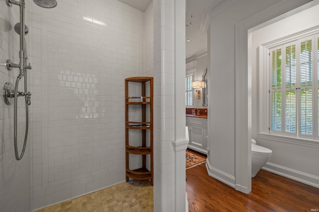 1403 E Jefferson Blvd, South Bend, IN 46617 - bathroom featuring toilet, tiled shower, and healthy amount of natural light