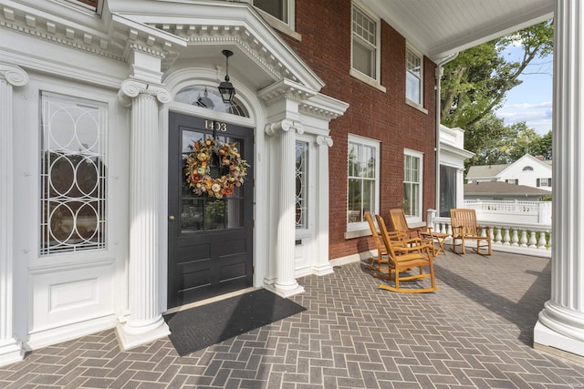1403 E Jefferson Blvd, South Bend, IN 46617 - property entrance featuring covered porch and brick siding
