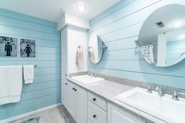 620 Ln 330 Big Otter Lk, Fremont, IN 46737 - bathroom with double vanity, wooden walls, tile patterned floors, and a shower with curtain