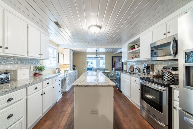 620 Ln 330 Big Otter Lk, Fremont, IN 46737 - kitchen with stainless steel appliances, wooden ceiling, a kitchen island, white cabinetry, and a sink