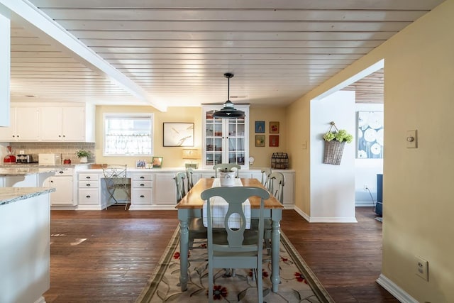 620 Ln 330 Big Otter Lk, Fremont, IN 46737 - dining area with dark wood finished floors, baseboards, and wood ceiling