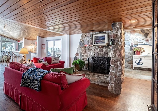 620 Ln 330 Big Otter Lk, Fremont, IN 46737 - living room with wood ceiling, healthy amount of natural light, a fireplace, vaulted ceiling, and wood finished floors