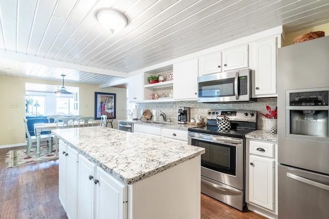 620 Ln 330 Big Otter Lk, Fremont, IN 46737 - kitchen with appliances with stainless steel finishes, wood ceiling with exposed beams, open shelves, dark wood-style flooring, and backsplash