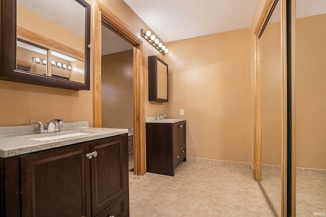 10227 Jefferson Rd, Osceola, IN 46561 - bathroom with two vanities and tile patterned floors