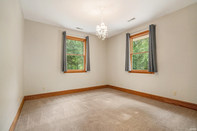 10227 Jefferson Rd, Osceola, IN 46561 - carpeted spare room with a chandelier and baseboards