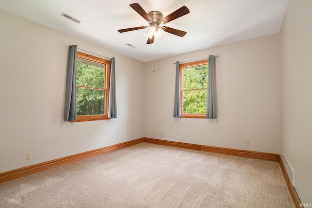 10227 Jefferson Rd, Osceola, IN 46561 - unfurnished room with light carpet, baseboards, and a ceiling fan