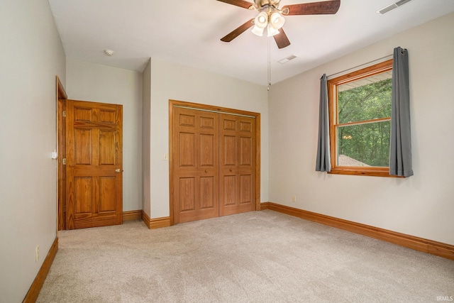 10227 Jefferson Rd, Osceola, IN 46561 - unfurnished bedroom with carpet, a closet, baseboards, and a ceiling fan