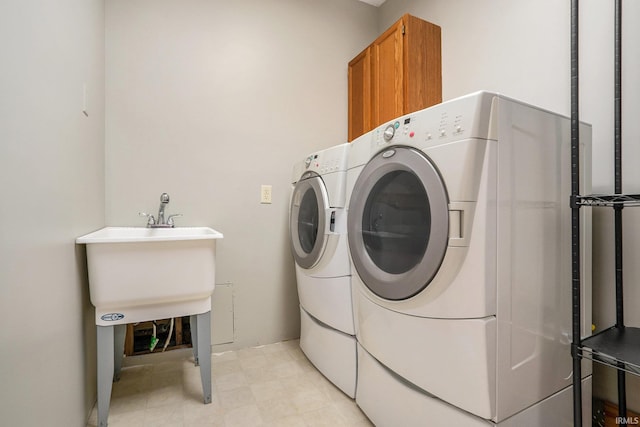 10227 Jefferson Rd, Osceola, IN 46561 - washroom with washer and clothes dryer and cabinet space