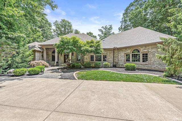 1411 Santanna Dr, Lafayette, IN 47905 - view of front facade featuring a shingled roof and brick siding