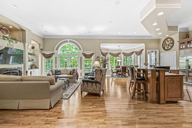 1411 Santanna Dr, Lafayette, IN 47905 - living room with light wood-style flooring, crown molding, recessed lighting, and a high ceiling