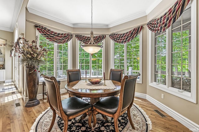1411 Santanna Dr, Lafayette, IN 47905 - dining room with crown molding, light wood-type flooring, and baseboards