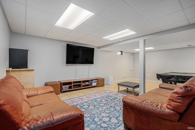 55177 Ardith St, Osceola, IN 46561 - living area featuring a paneled ceiling, wood finished floors, and baseboards