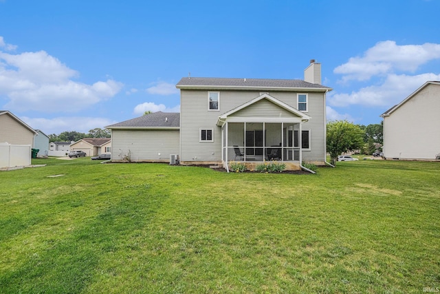 55177 Ardith St, Osceola, IN 46561 - back of property featuring a chimney, a yard, and a sunroom