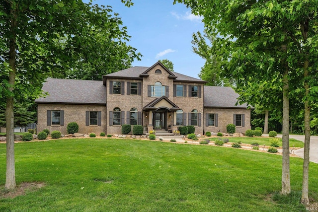 4906 N 100 W, Uniondale, IN 46791 - view of front of house with brick siding, a front lawn, and a shingled roof