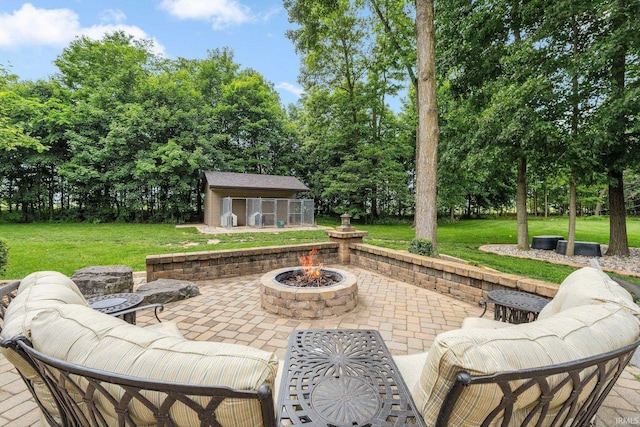 4906 N 100 W, Uniondale, IN 46791 - view of patio / terrace featuring a fire pit, an outbuilding, and view of scattered trees
