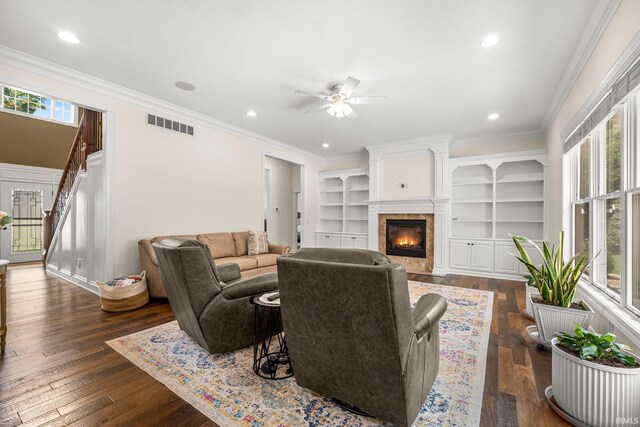 4906 N 100 W, Uniondale, IN 46791 - living area featuring ceiling fan, dark wood-style flooring, ornamental molding, a fireplace with flush hearth, and recessed lighting