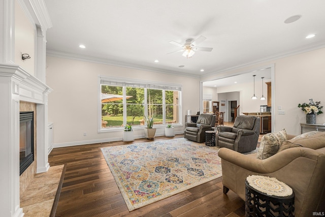 4906 N 100 W, Uniondale, IN 46791 - living area with ceiling fan, ornamental molding, dark wood finished floors, recessed lighting, and a fireplace