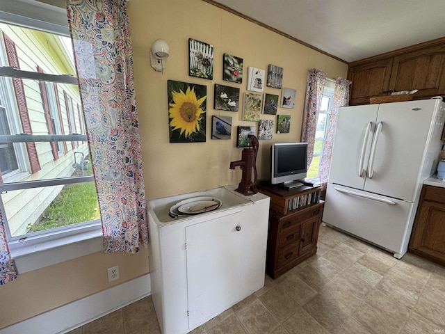 3151 W 150 N, Logansport, IN 46947 - kitchen featuring freestanding refrigerator, plenty of natural light, and light countertops